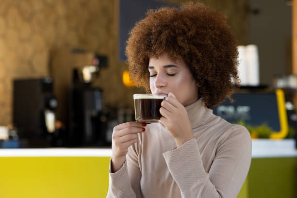 Woman drinking coffee in a cafe