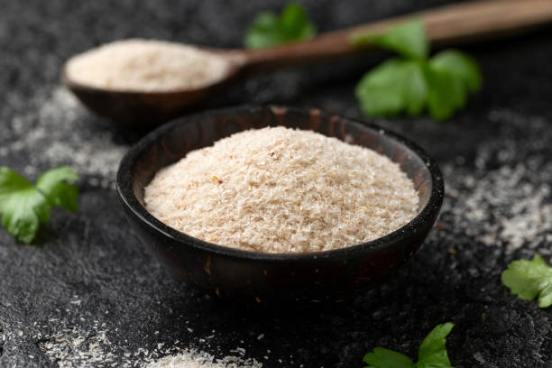 Natural organic Psyllium seeds husk fibre in bowl.