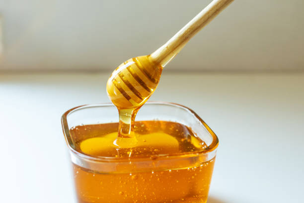 Honey and honey dipper