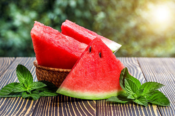 Fresh sliced watermelon wooden old background